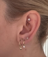 Piercing titanium curved bloem 1.2x8 - goud